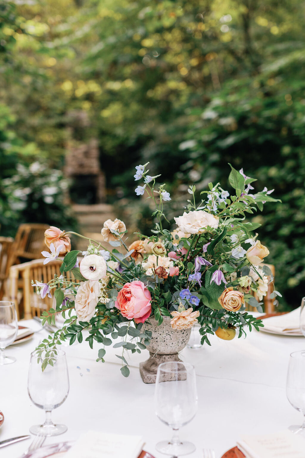 Romantic autumn floral centerpiece with candles, garden roses and lush natural greenery. Wedding floral design at RT Lodge by Rosemary and Finch in Nashville, TN.