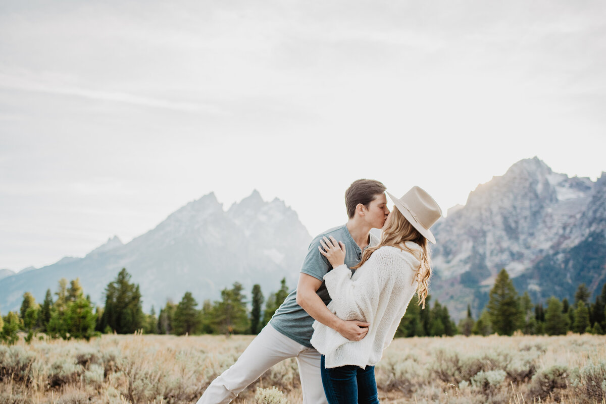 Photographers Jackson Hole capture man and woman kissing during engagements