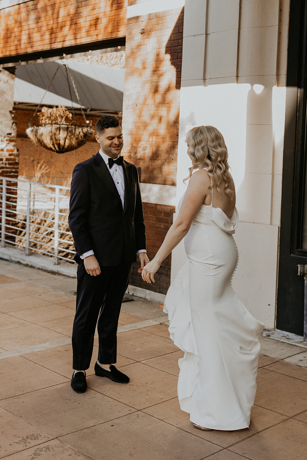 bride and groom having a first look in downtown Knoxville