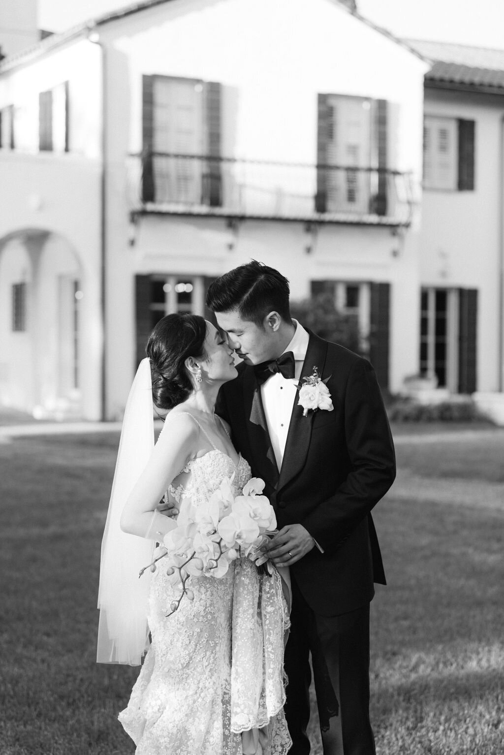 black and white image of bride and groom almost kissing taken by Jekyll Island Wedding Photographer, Rhonda Rowell