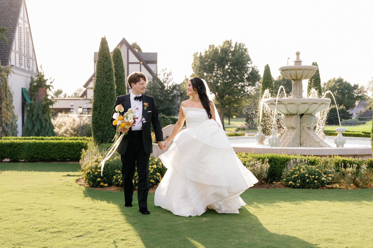 Summer OKC family photos with family posed in front of a blue Volkswagen beetle.