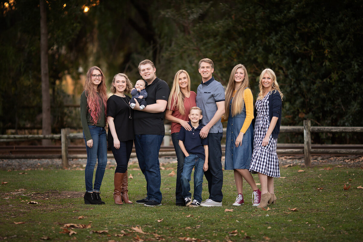 Dallas family photography session with parents, children, and a baby at a park.