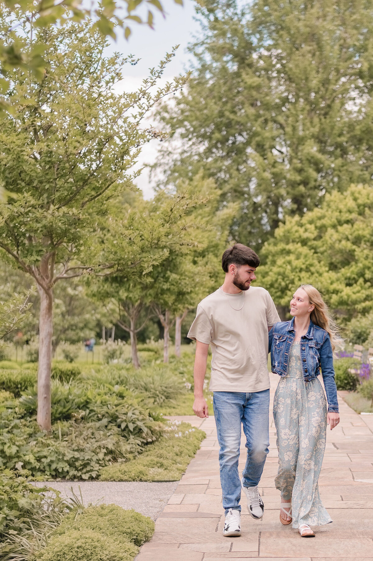 Couple walking in a scenic Pittsburgh park — candid couples portraits by Bree Stewart of Lens Love Photography.