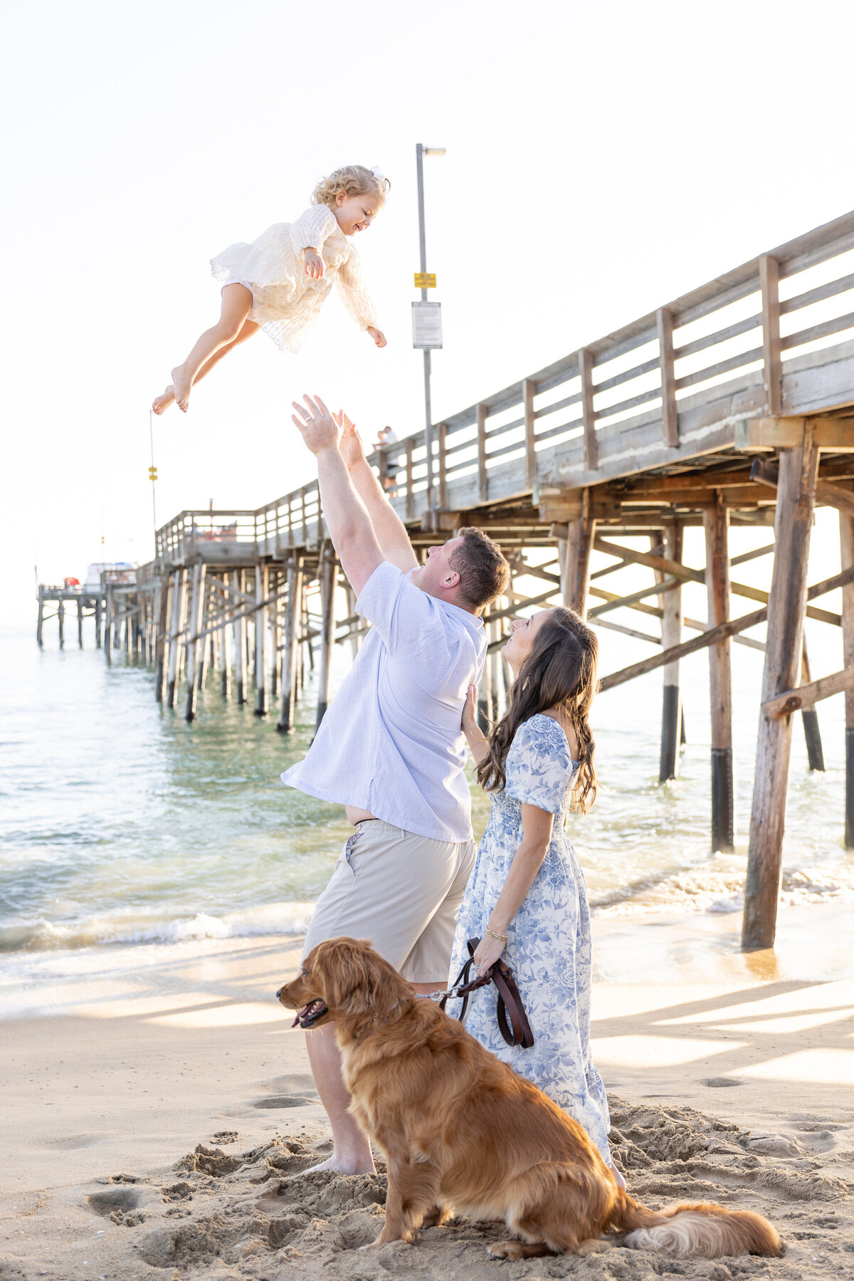 playful family photo with dog
