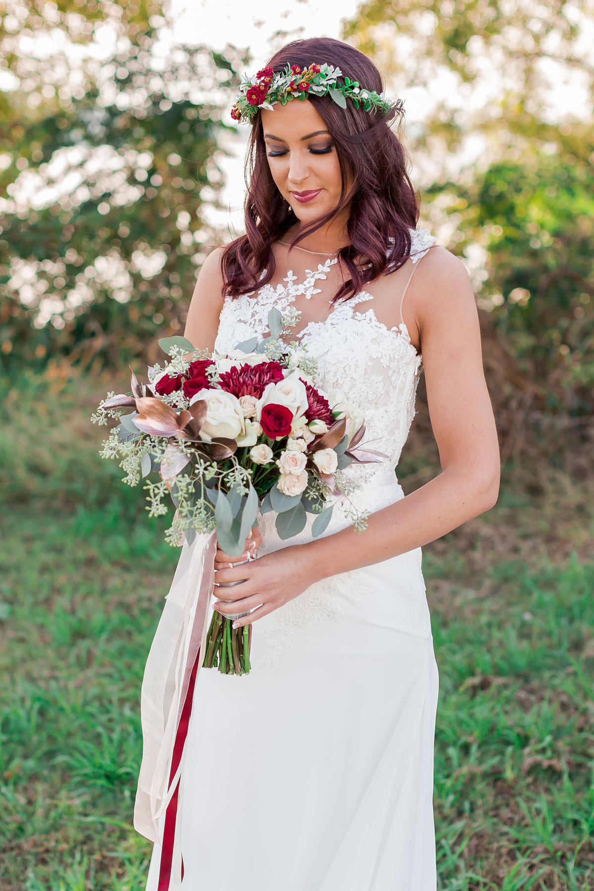 Bride holds her bouquet at The Obici House