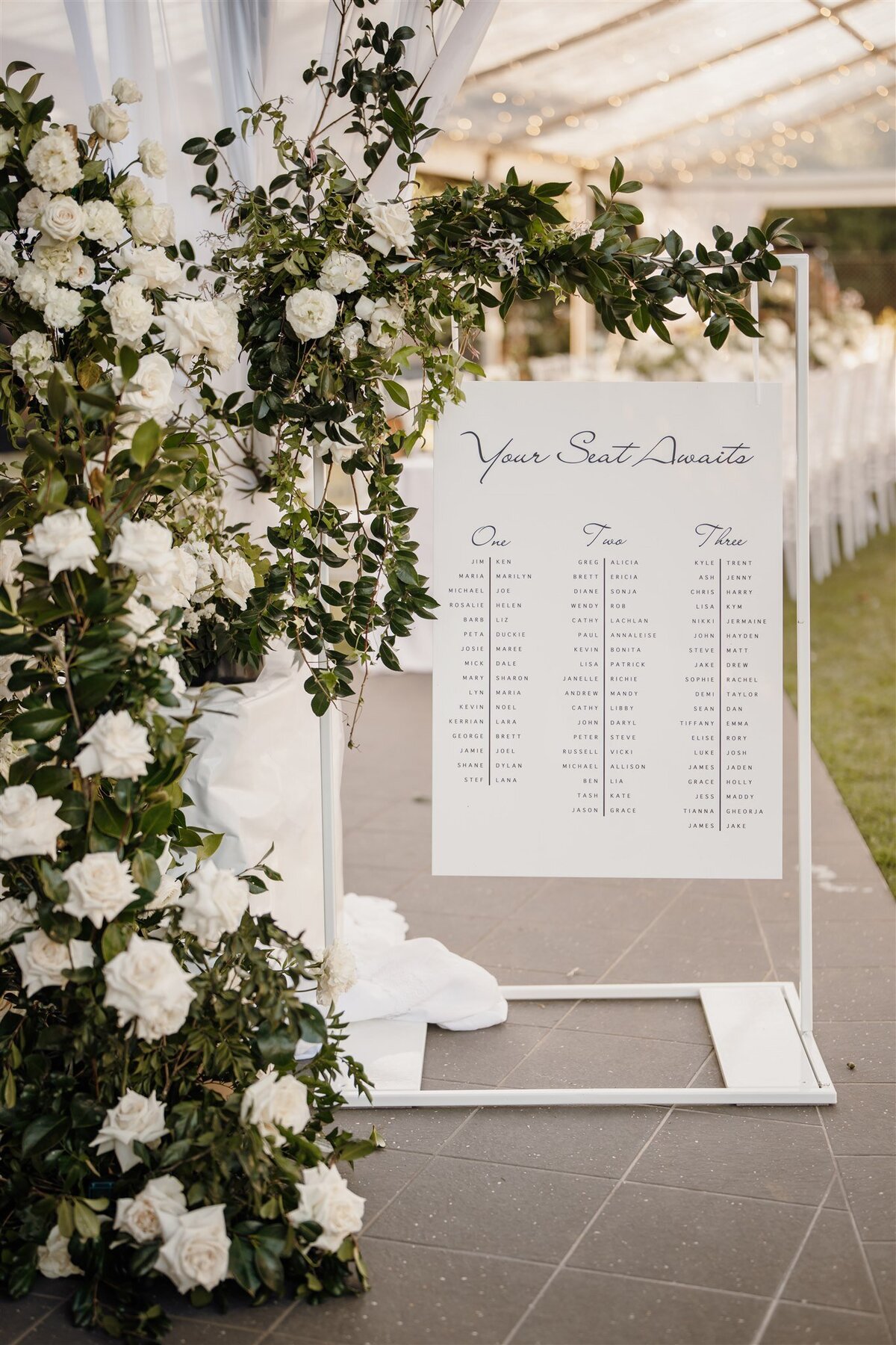Statment white seating chart flowers Noosa weddings