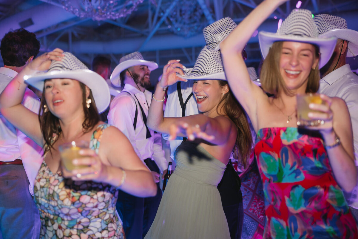 Guests dancing on dance floor at reception at El Chorro