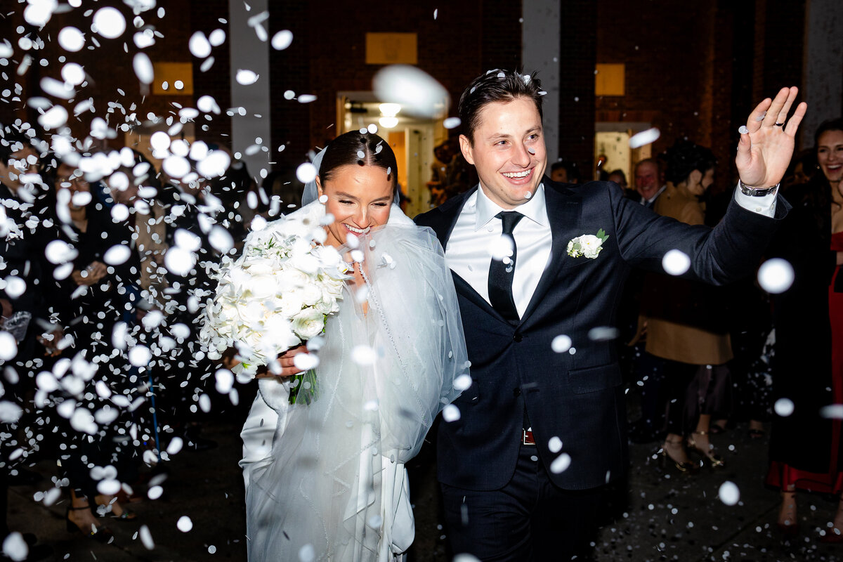 couple-leaves-church-snow-winter-wedding-lisa-gilbert-photography