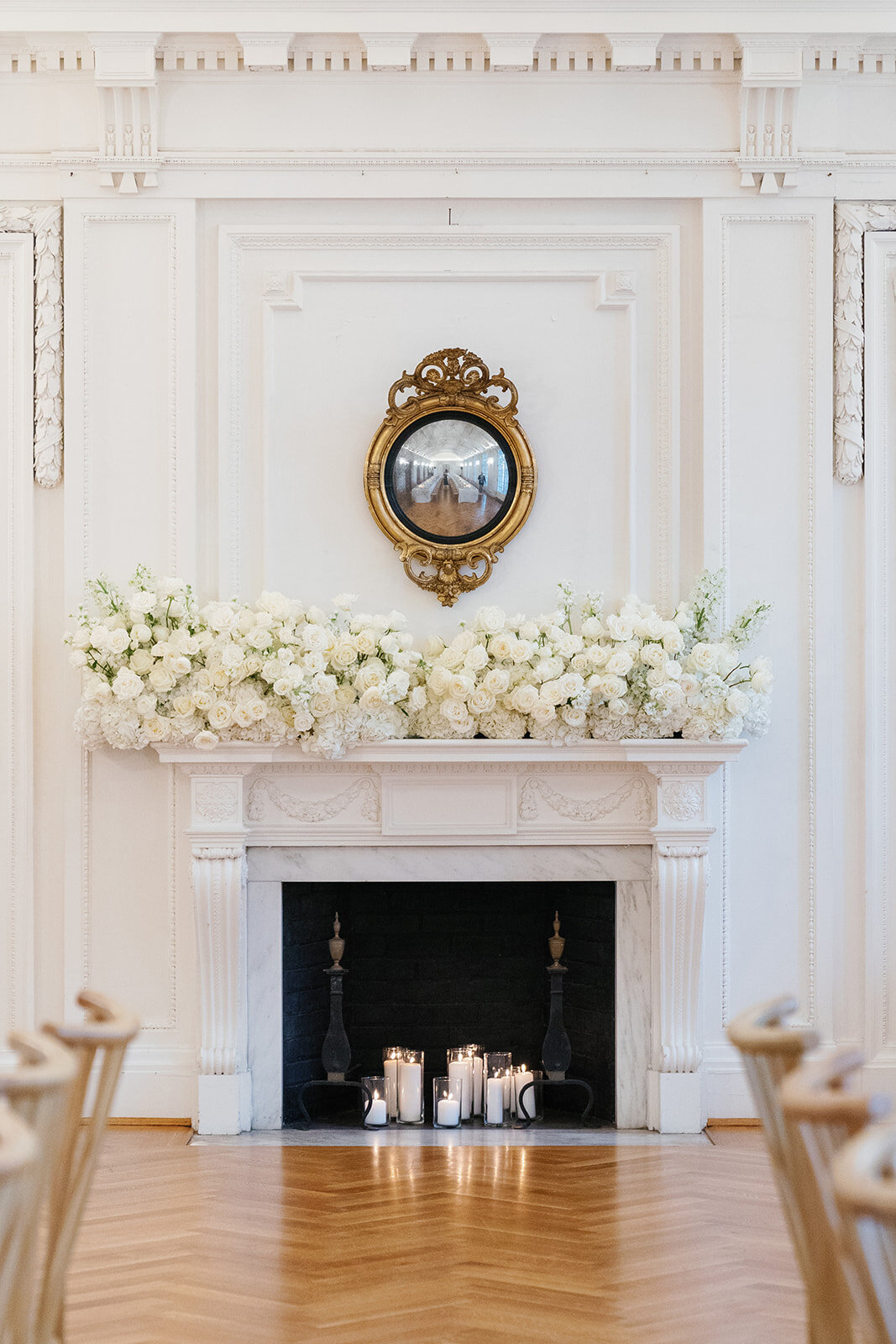 All white flowers mantle design for wedding.