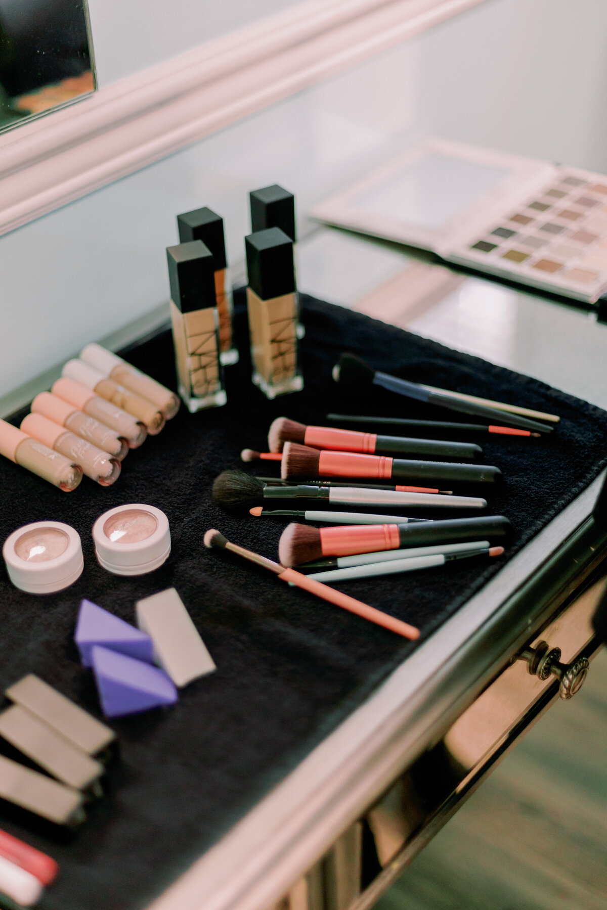 Makeup sits on a tray.