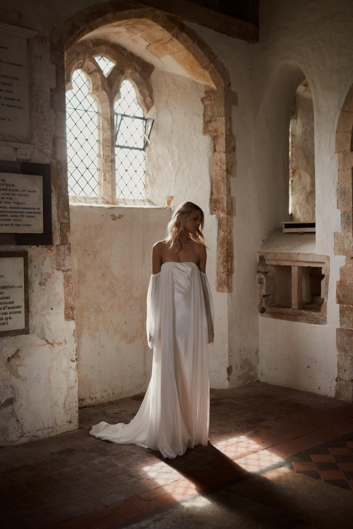Long sleeved silk wedding dress with detachable sleeves by British bridal designer