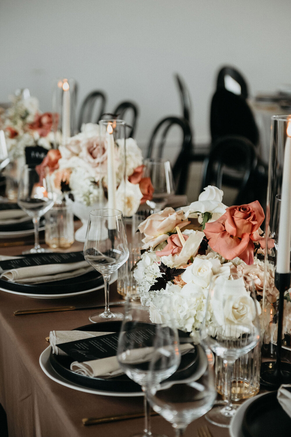 Wedding reception tablescape in black,pink and white.