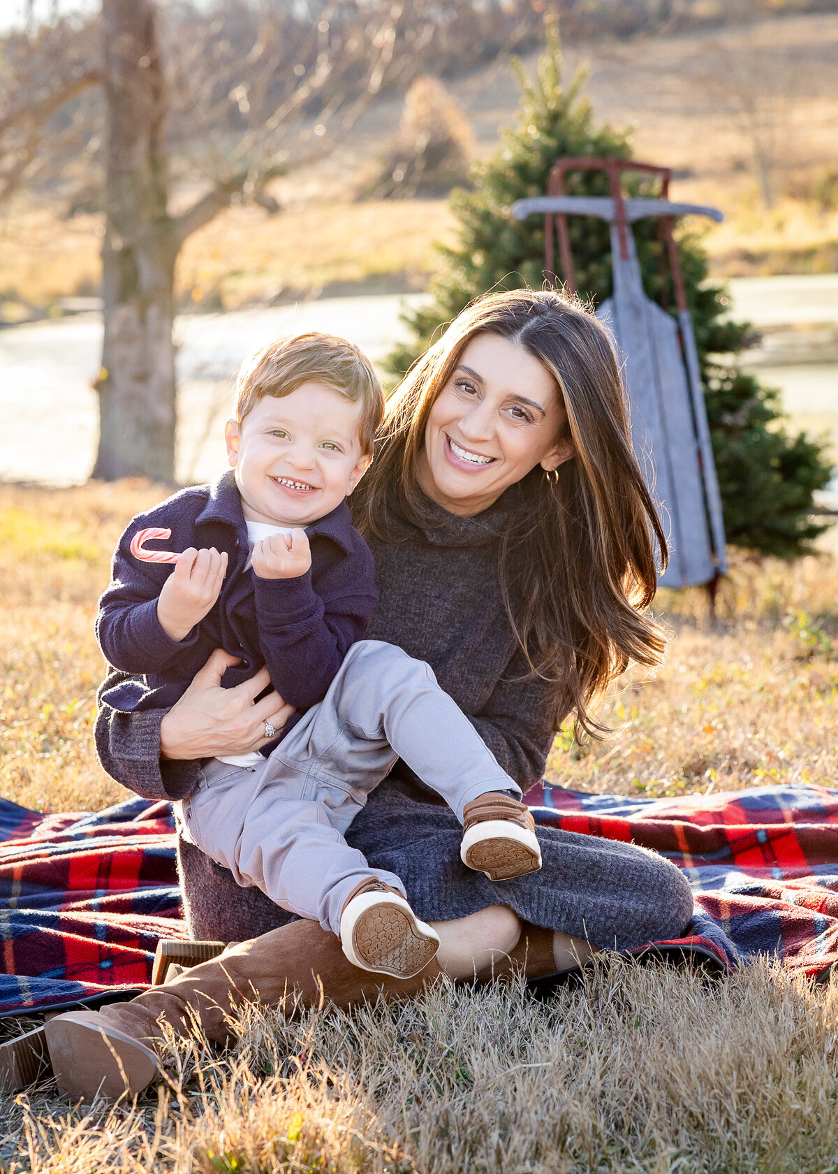 Mother hugging son at a Christmas tree farm in Somerset County, NJ