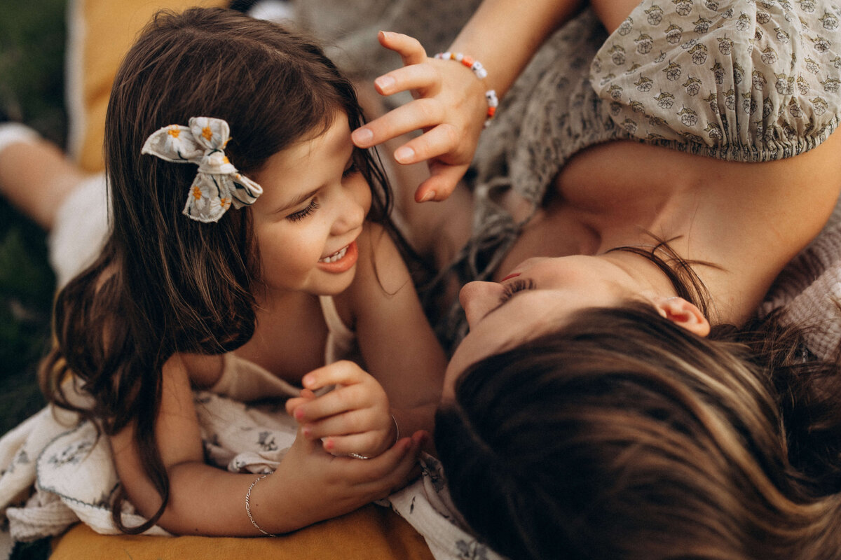 Mother-stroking-daughters-face