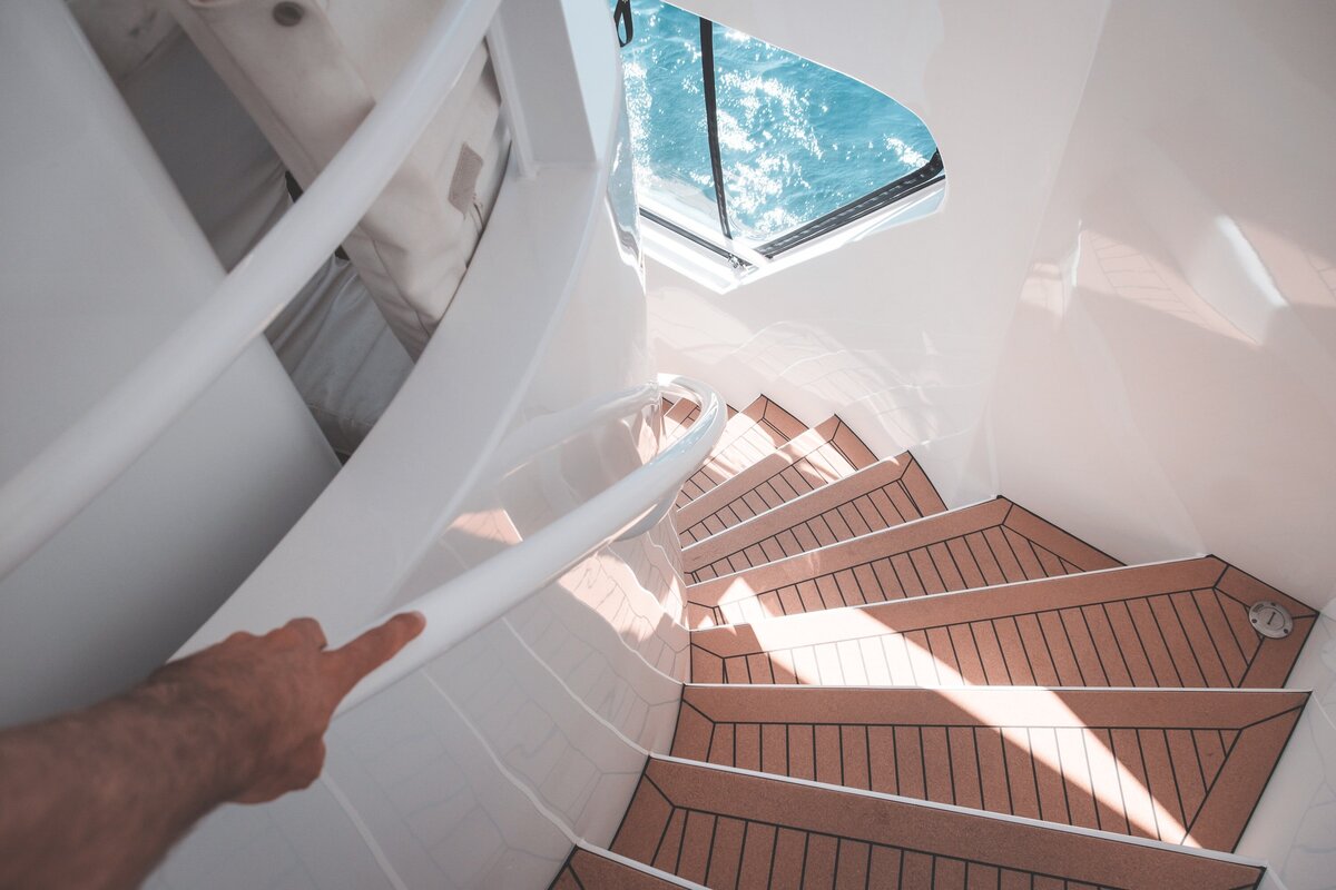 Man walking down stairs of Yacht