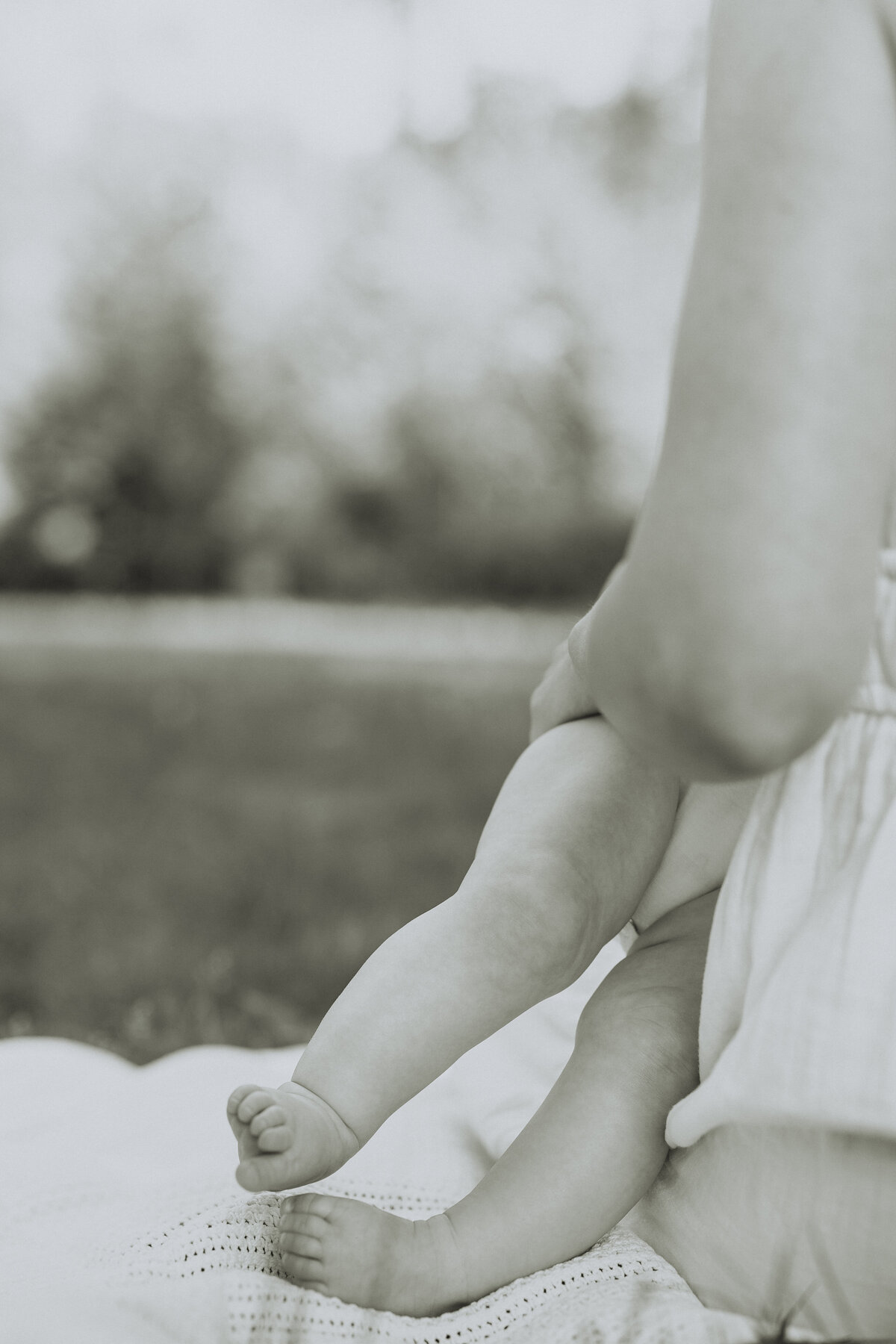 Black and whit photo of a baby's feet taken by a Langley Family Photographer