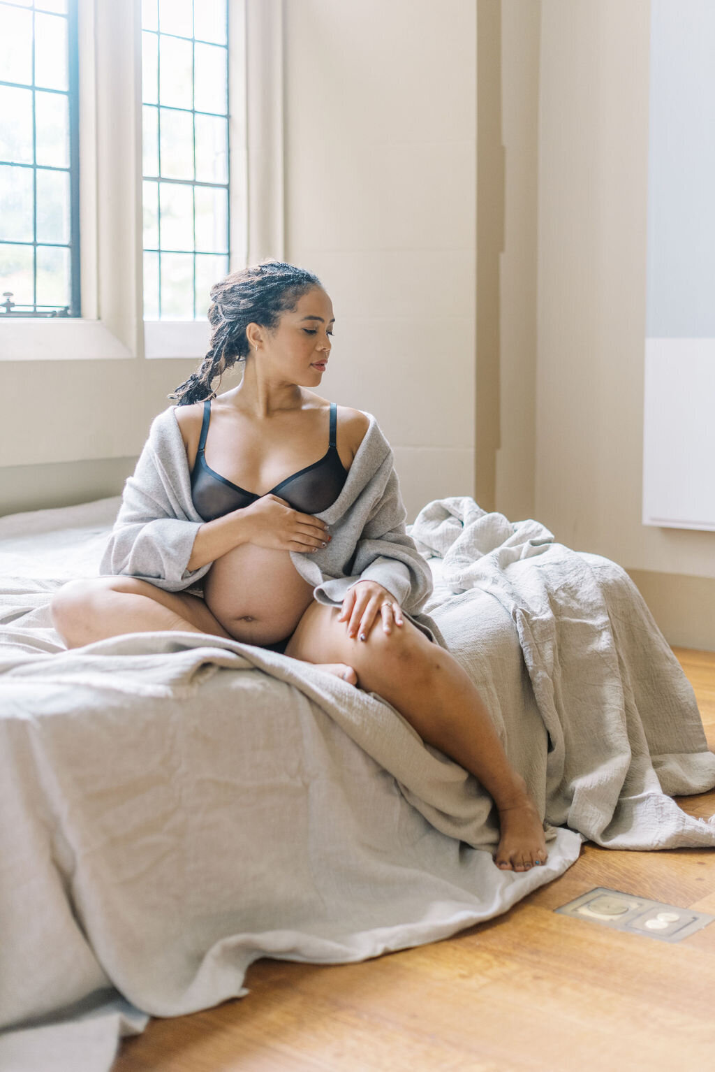 Richmond maternity photography | Film image of a pregnant mother holding her exposed belly by Jacqueline Aimee Portraits