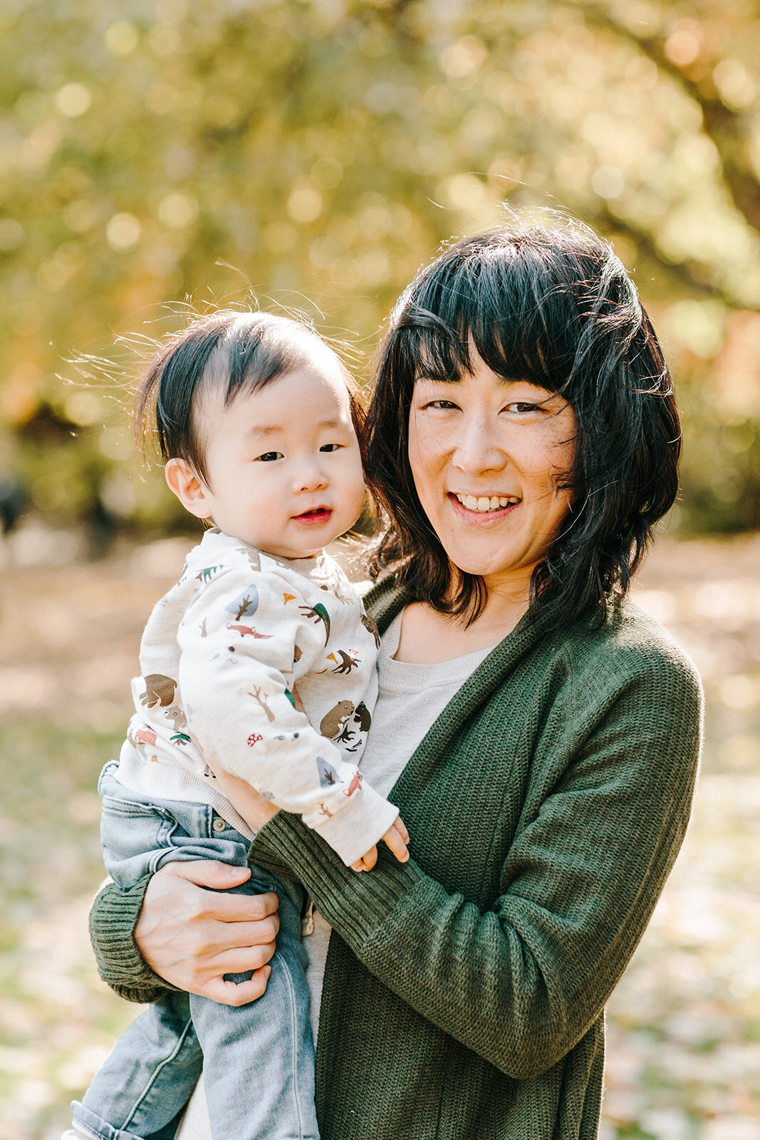 Utah Family Photographer captures woman holding baby smiling