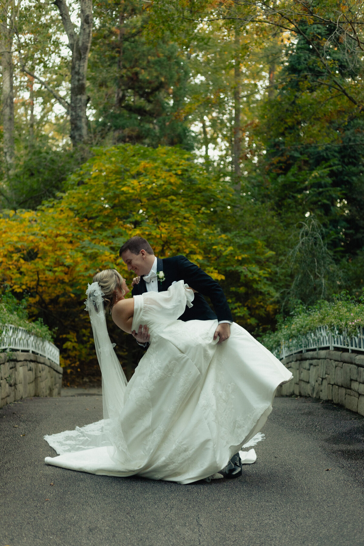 Groom dips his bride. 