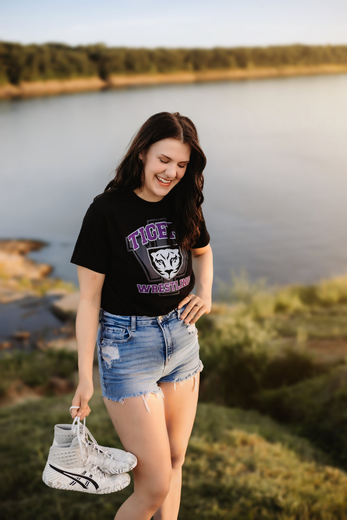 This senior shows off her wrestling shoes.