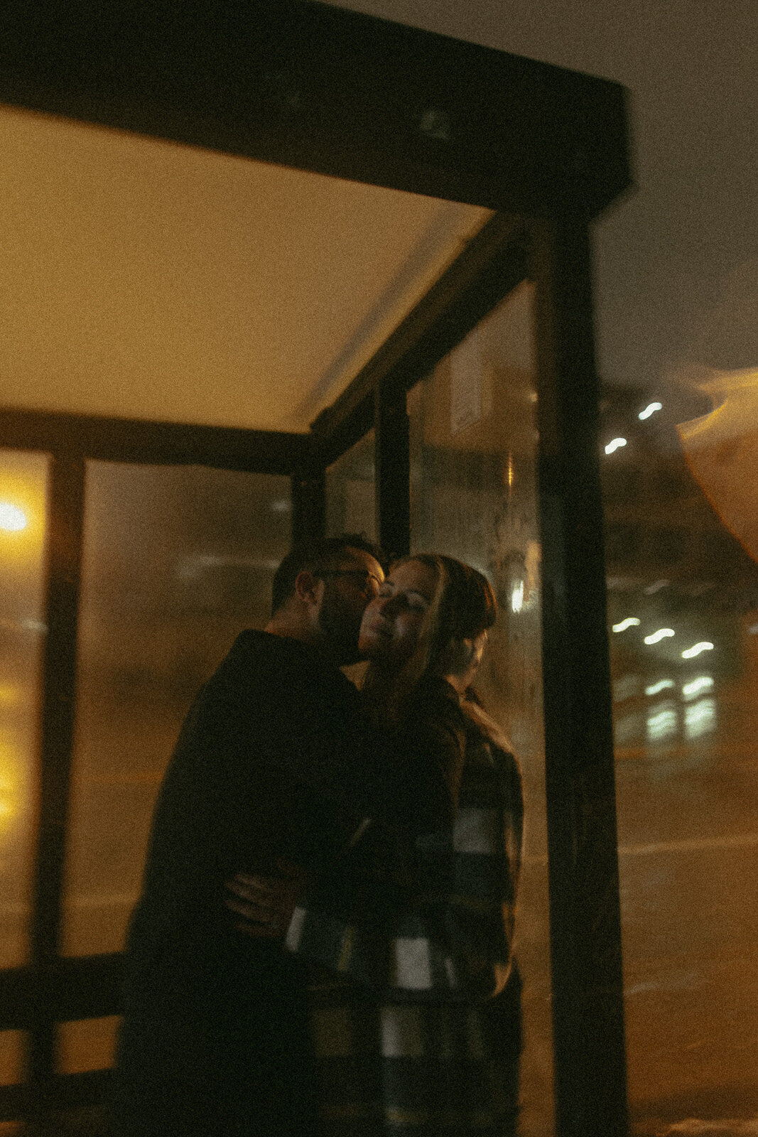 couples-rain-playful-night-session-downtown-moody-umbrella-film-illinois-46