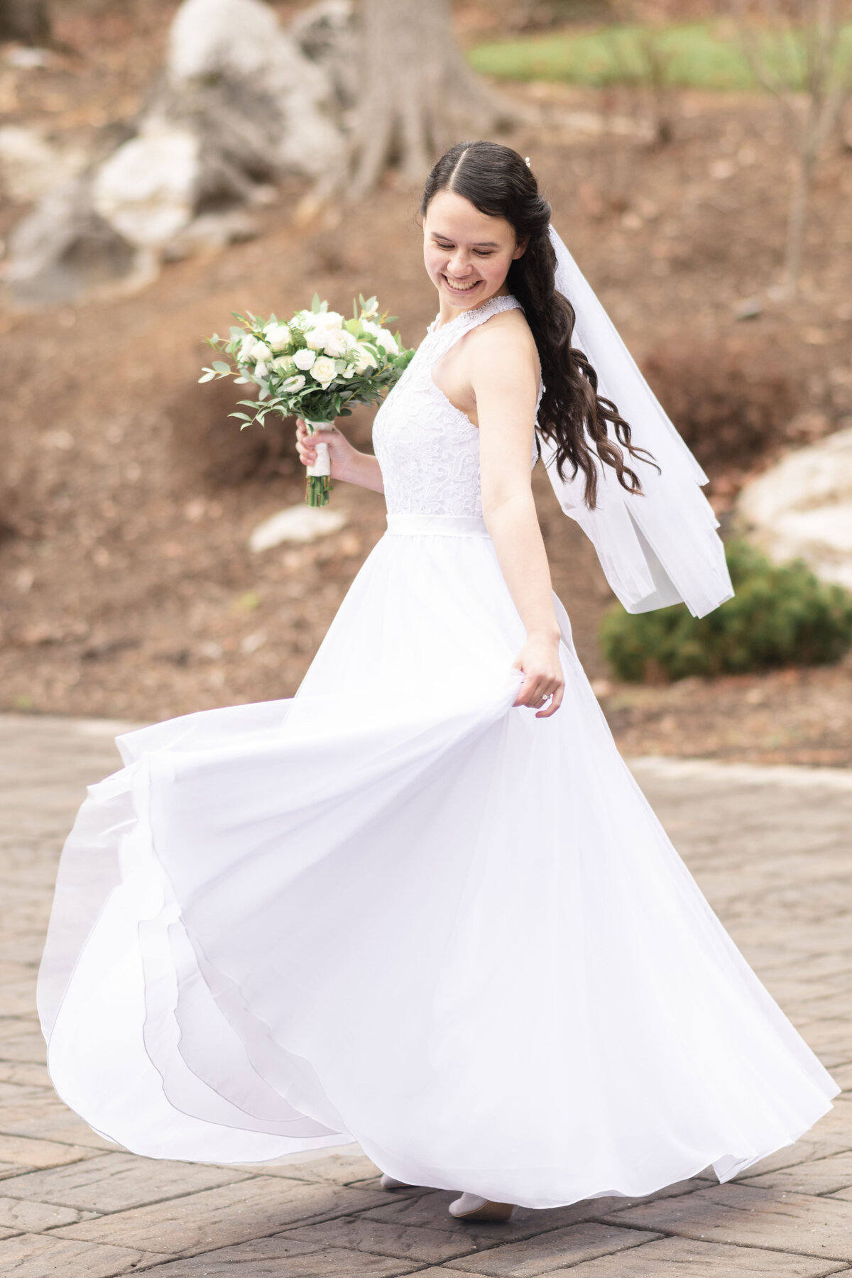 Bride twirling in her dress