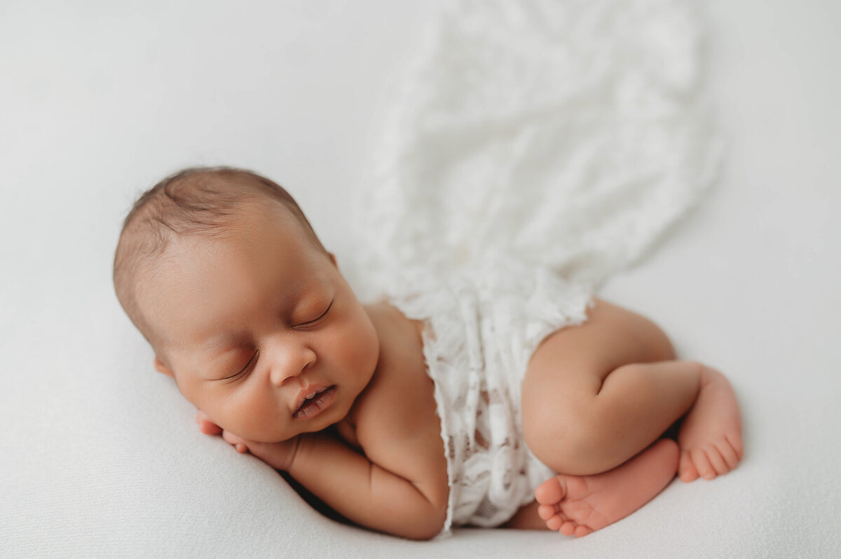 Newborn Baby posed for Newborn Photoshoot in Asheville, NC.