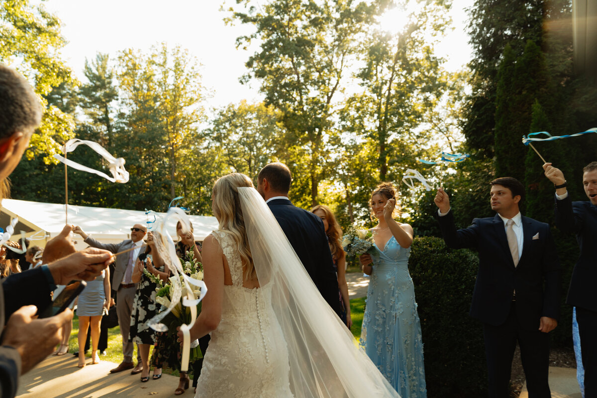 bride walking down aisle with her dad