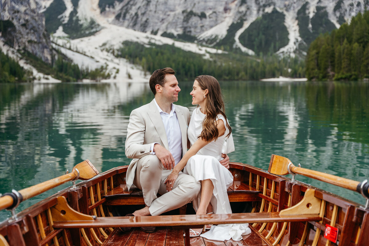 Couple sitting stylish boat wedding portrait