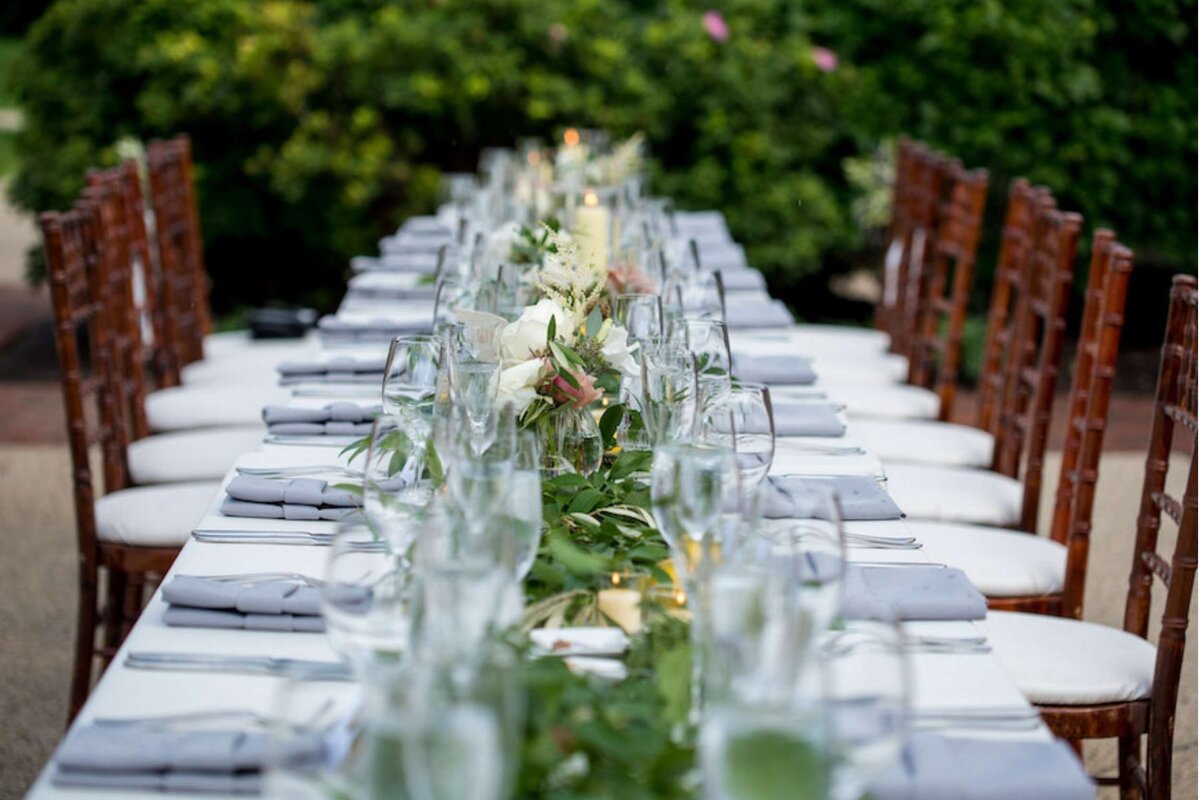 Long table design for an outdoor dinner at a luxury Italian inspired Chicago North Shore wedding.