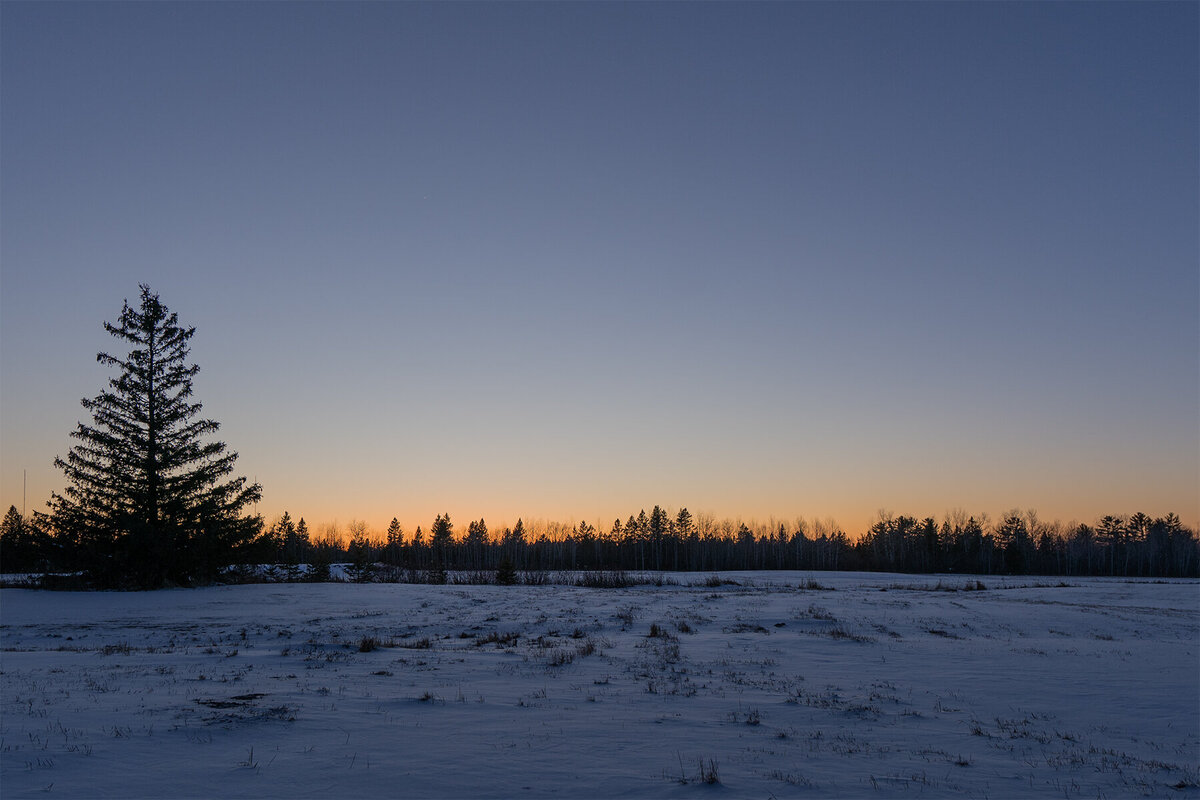 Sunset over a snowy field