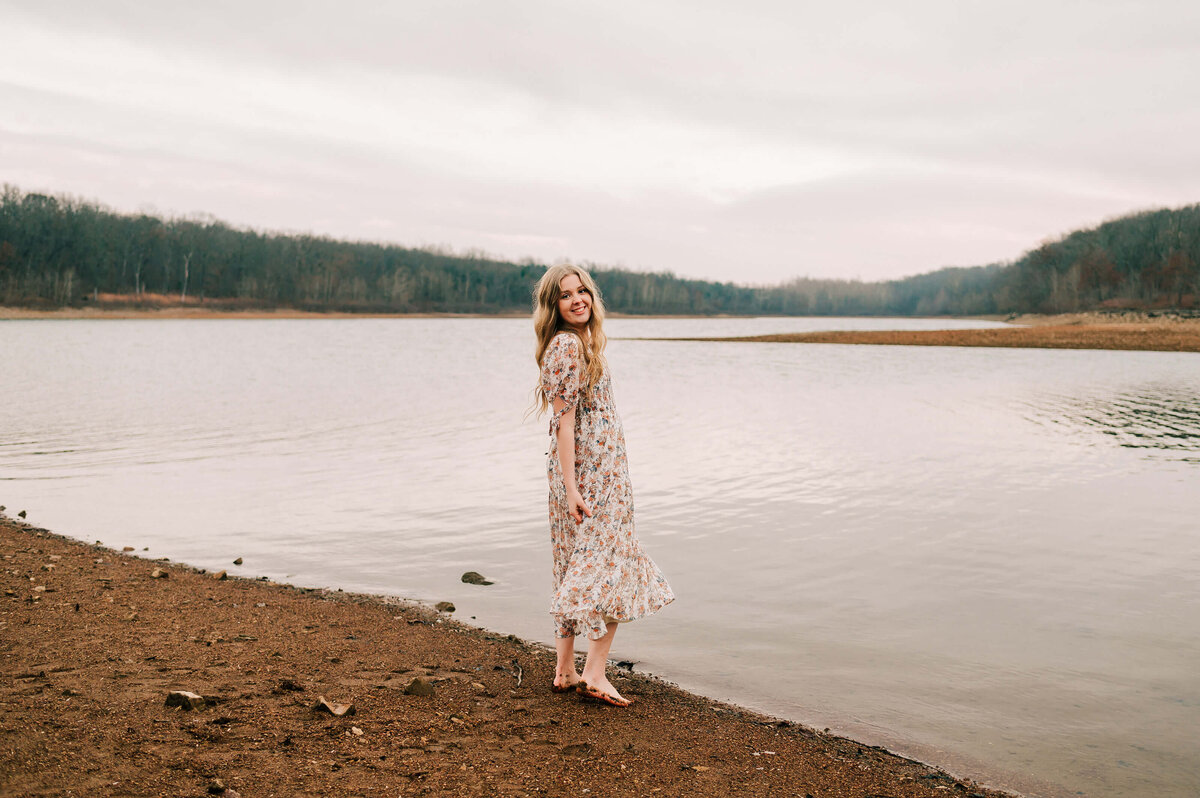 high school senior dancing in the lake