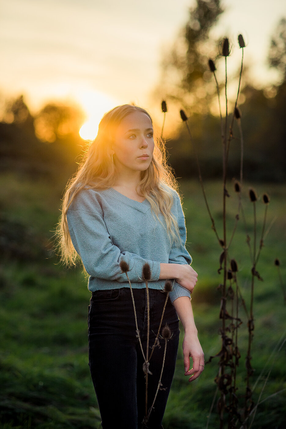 senior girl in sunny field