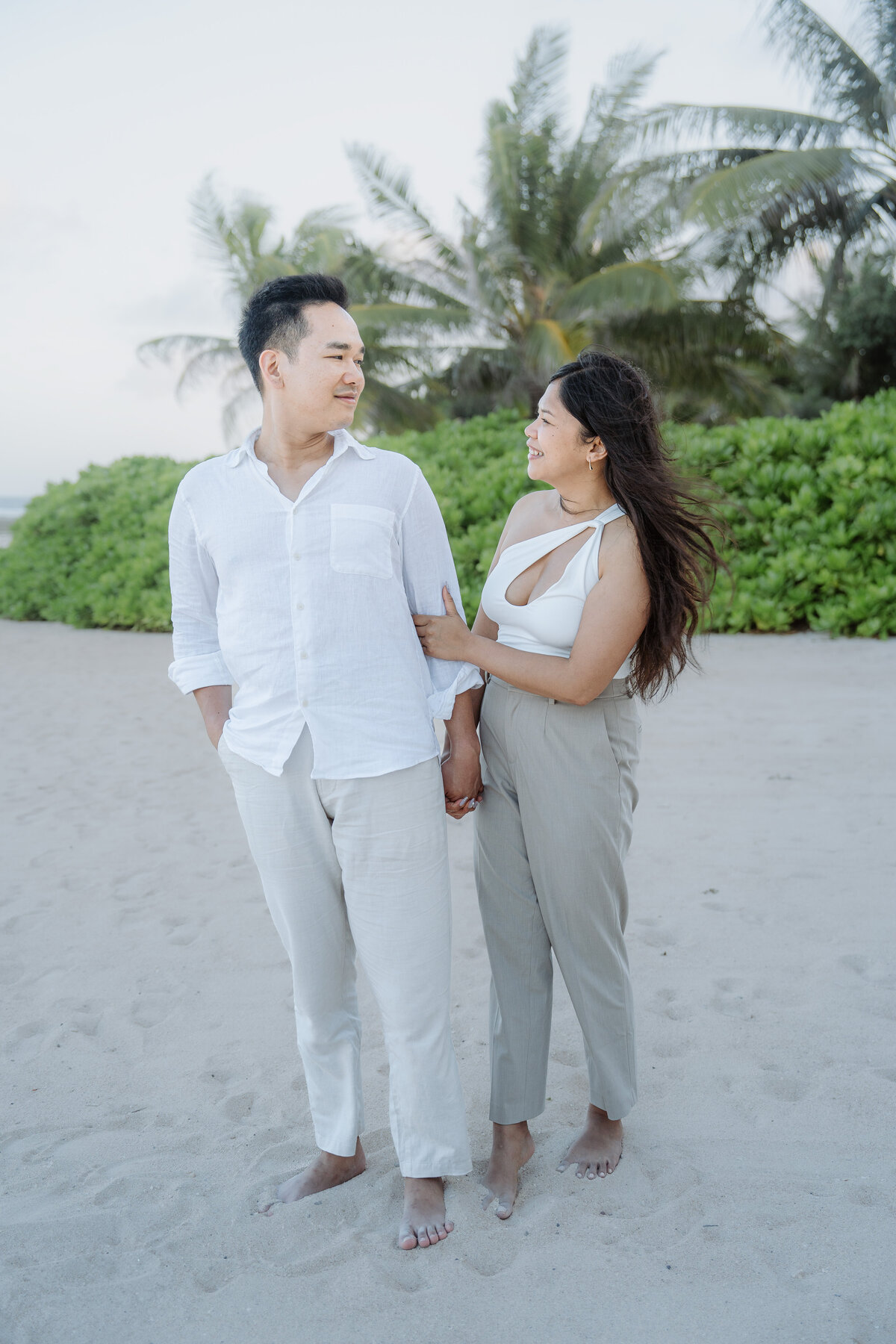 Bali Indonesia Elopement Asian Bride and Groom at Apurva Kempinski beach.
