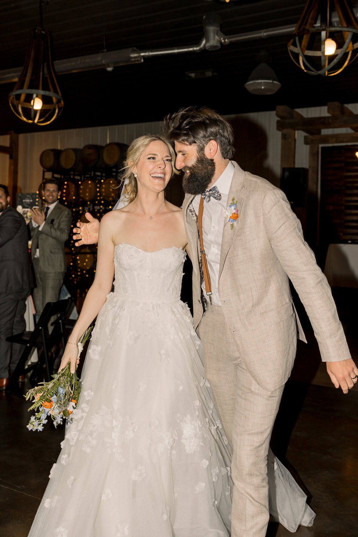 Bride and groom entering reception at their wedding at Carlos Creek Winery wedding venue in Alexandria MN