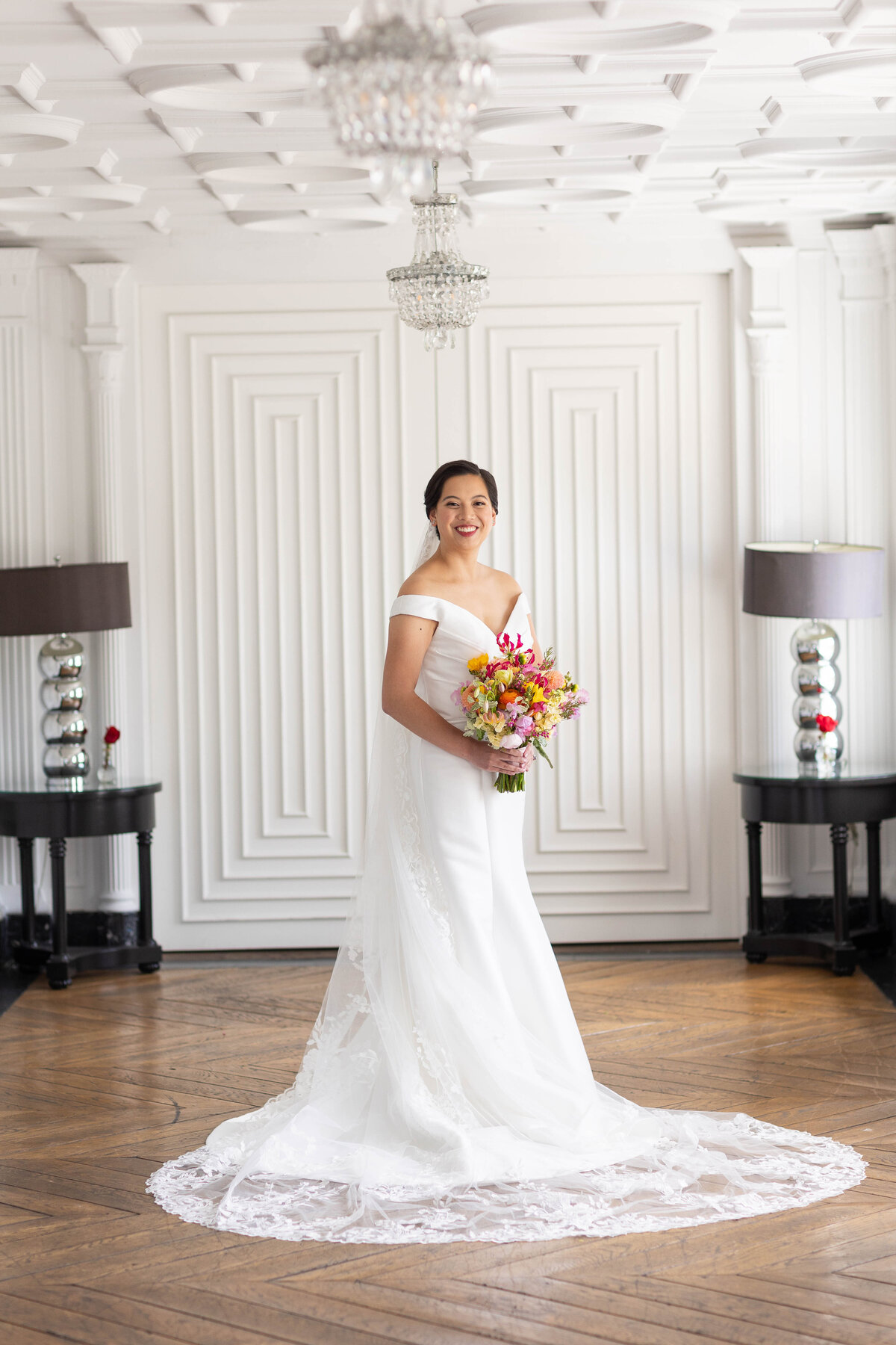 Bride wearing a bridal dress and holfing a bouquet of flowers