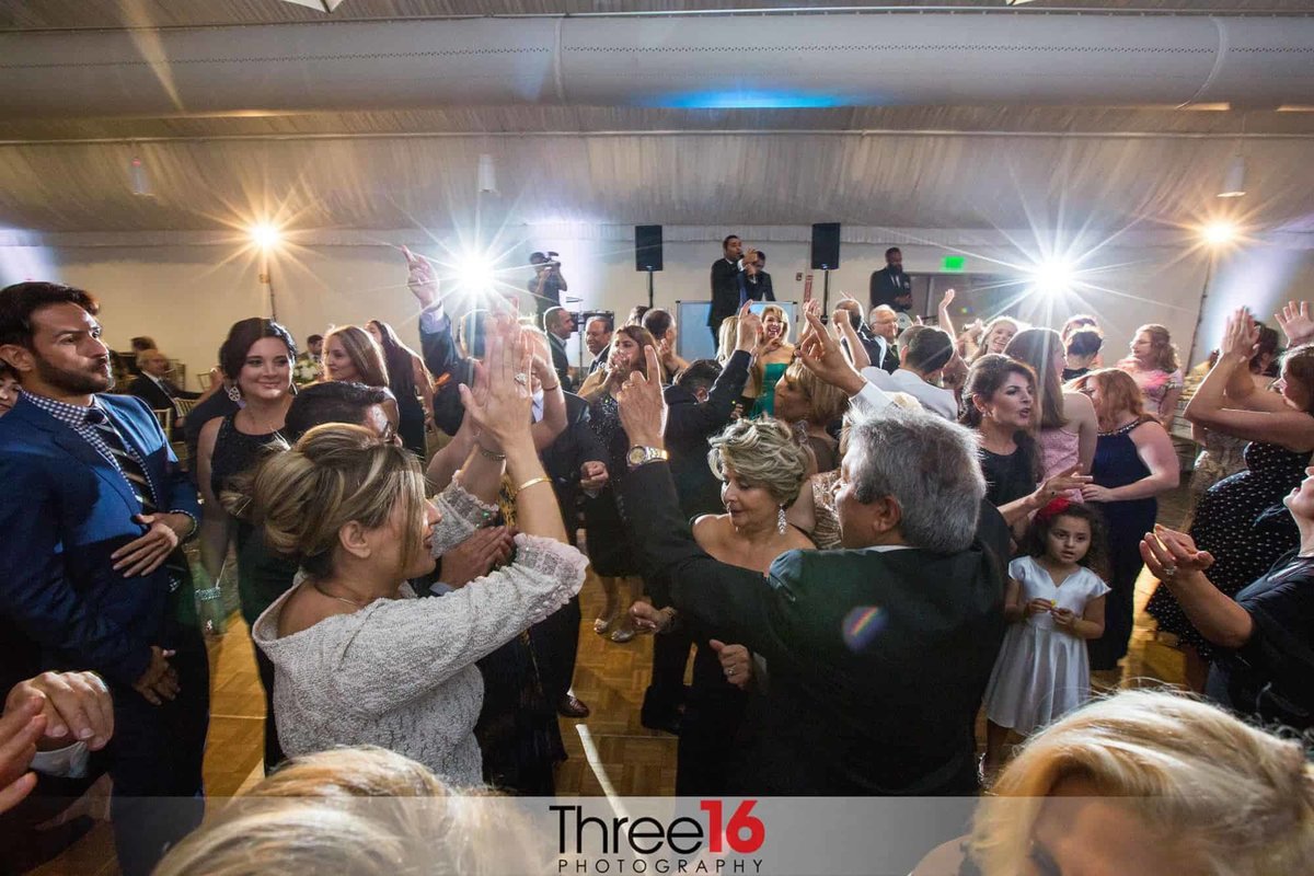 Guests flood the dance floor for a night of celebration