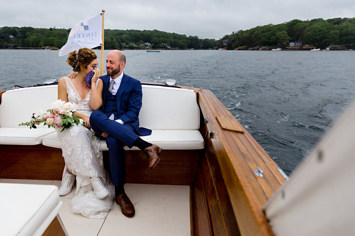 Linekin Bay Resort Wedding the bride and groom take a boat ride after their Boothbay Harbor Maine camp celebration