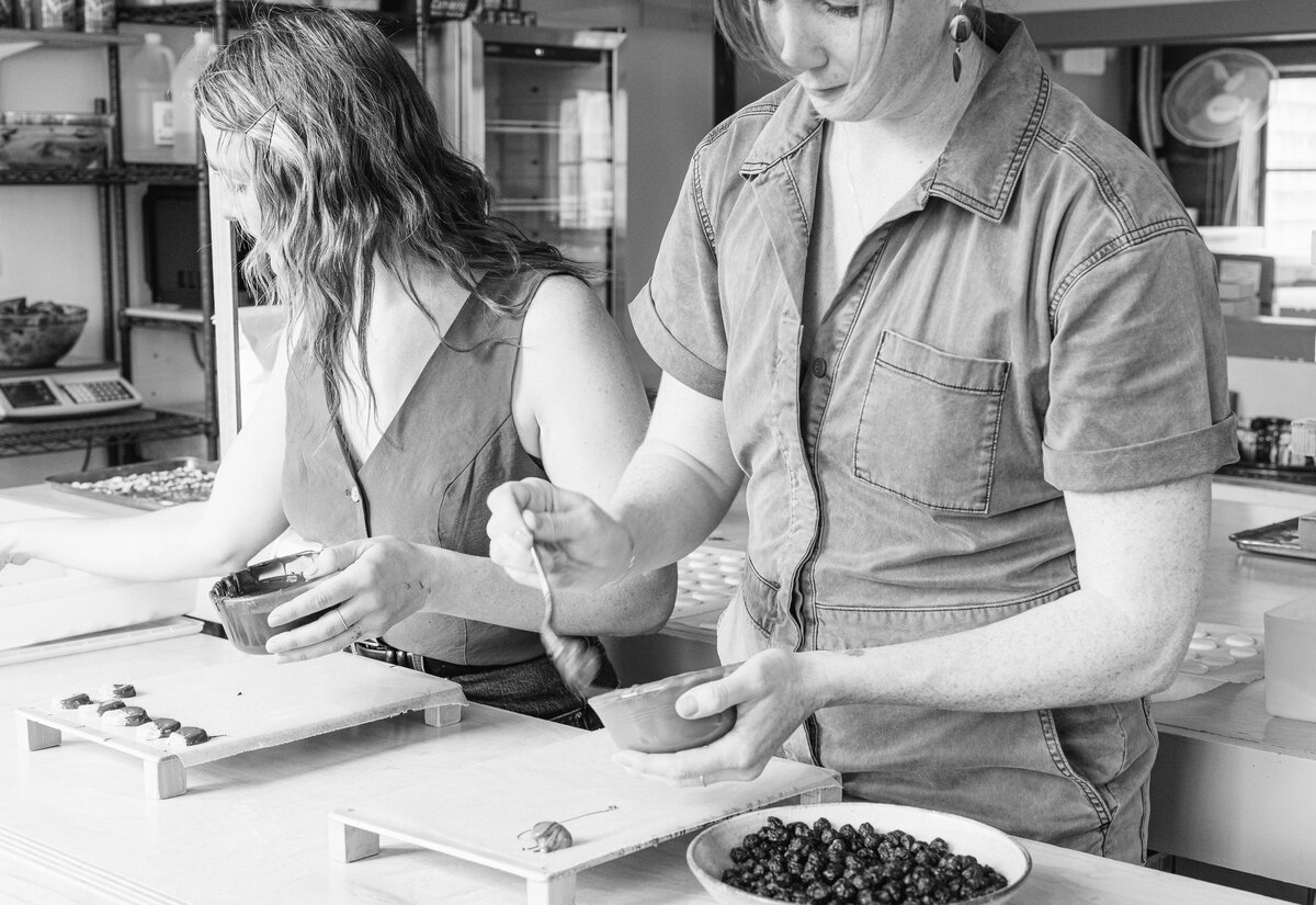 two girls making chocolate