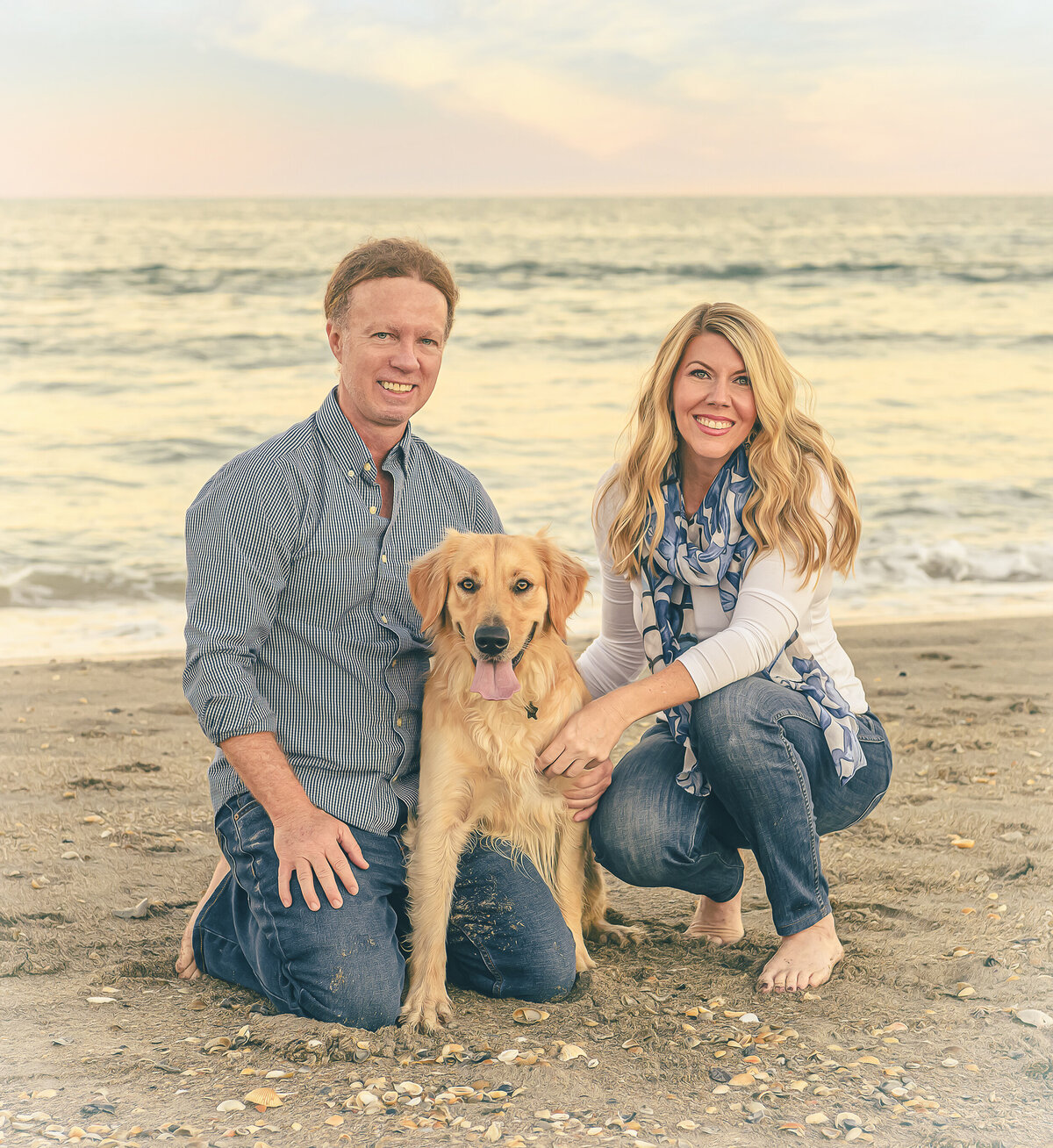 couple portrait with dog at cocoa beach