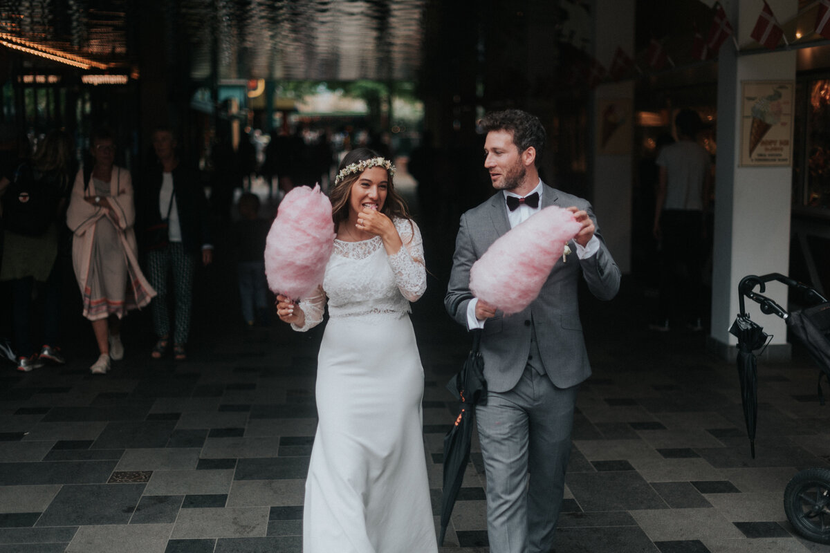 bride and groom eating candyfloss