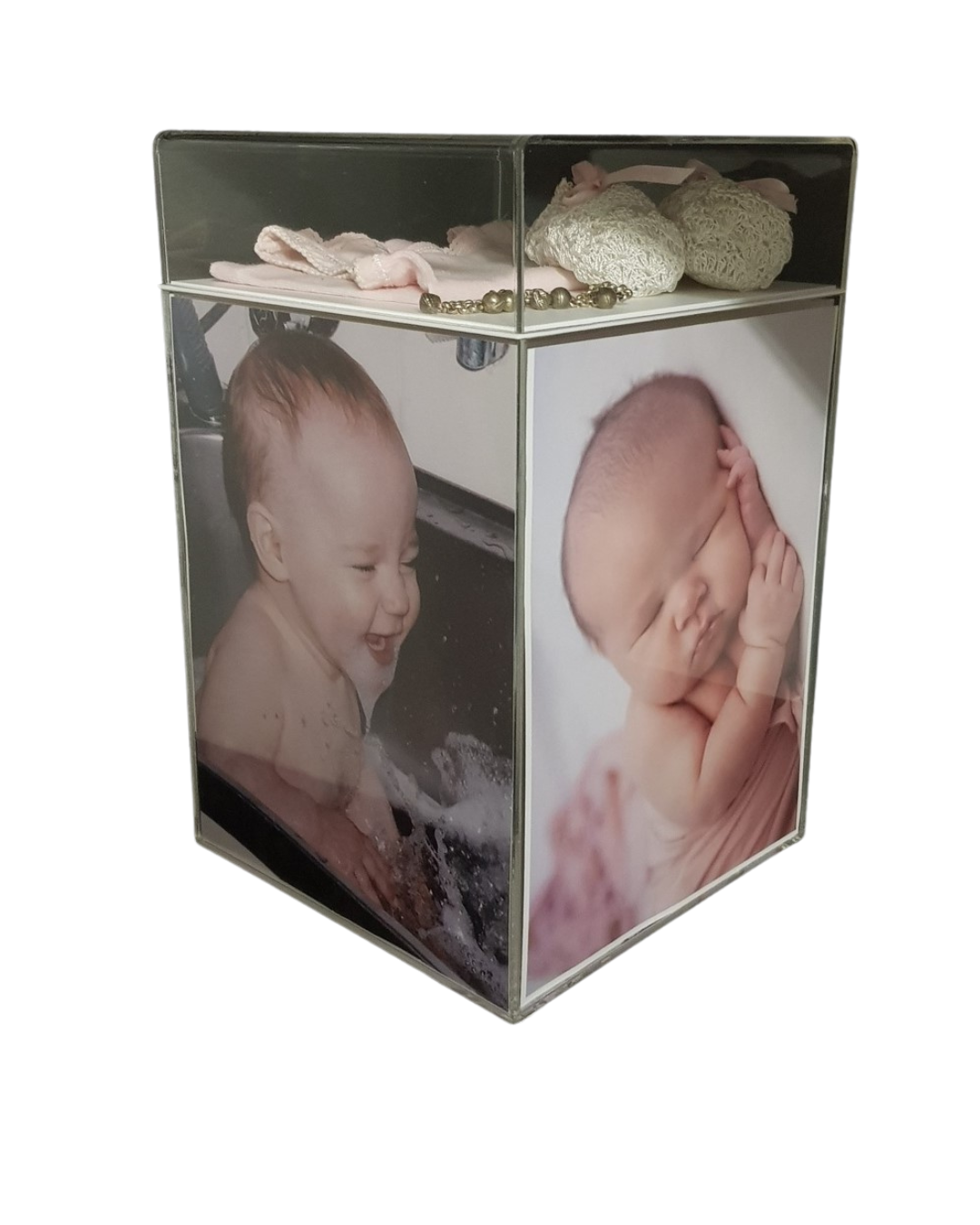 Baby keepsakes inside a perspex photobox