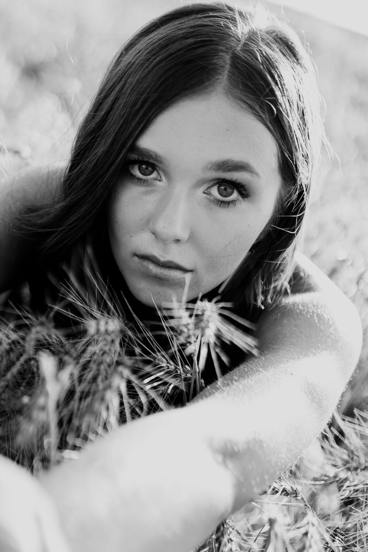 BLACK AND WHITE SENIOR IN WHEAT FIELD