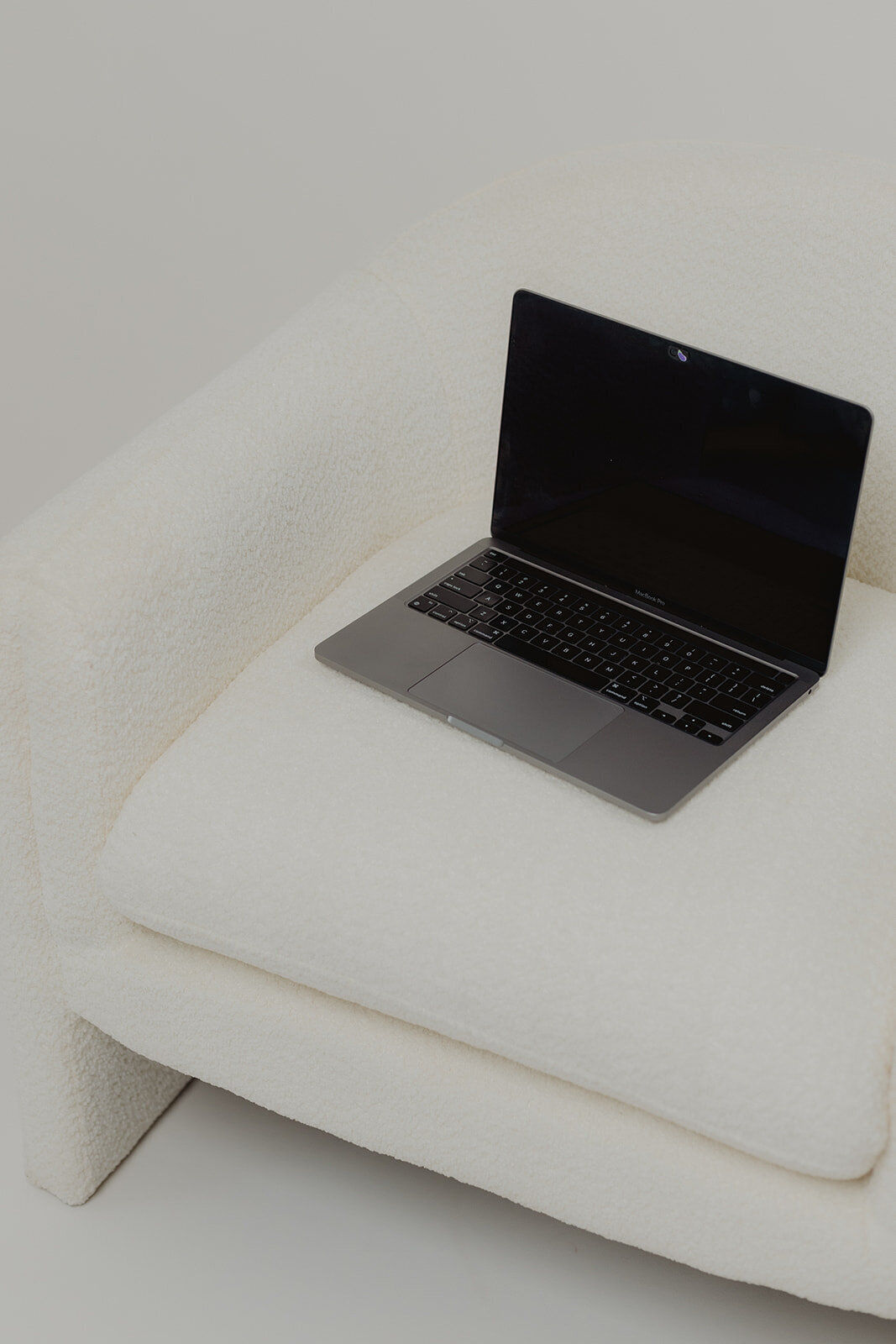 laptop on a white couch