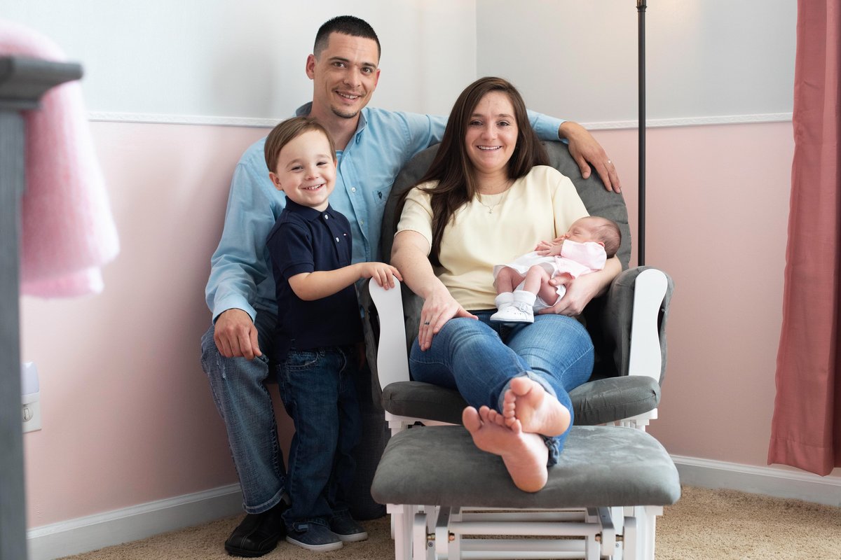 family in nursery with newborn