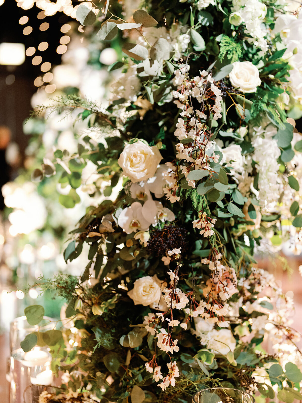 A close up of the roses and floral arrangement for the wedding at the Theater on the Lake. 