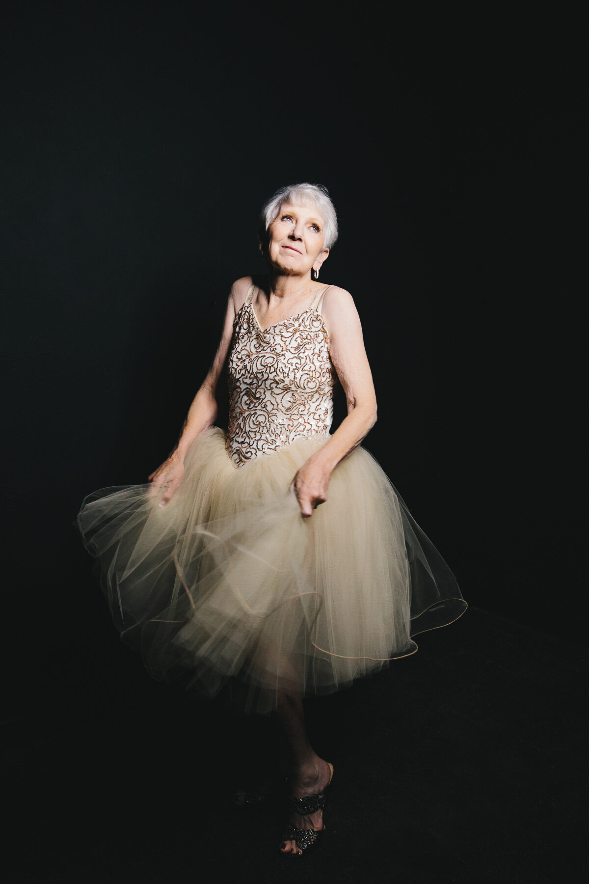 Beauty portrait of older woman wearing adorable tutu dress