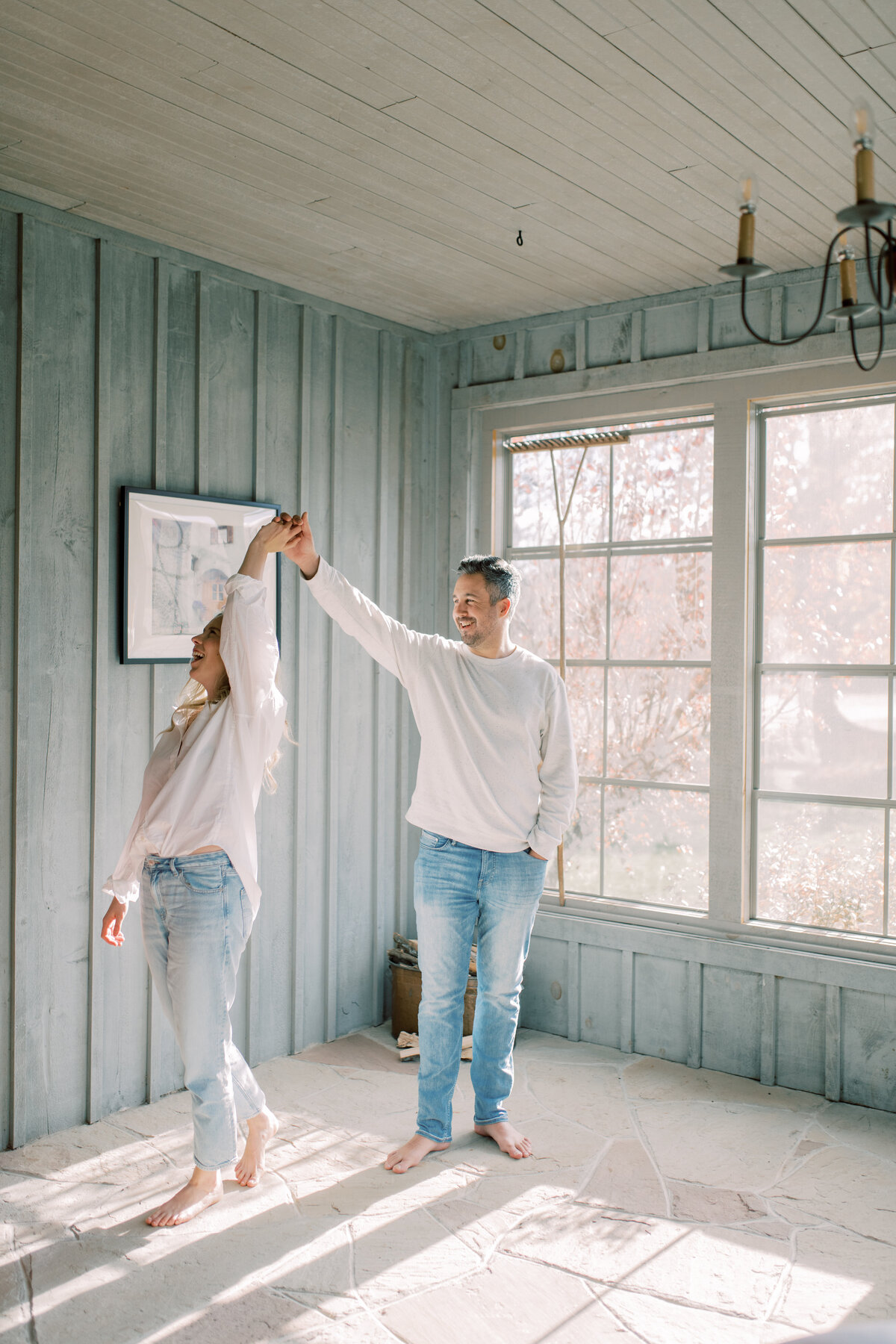 Laughter dances between them as they share a warm morning drink by the bright windows of Elora ON, their smiles lighting up the room