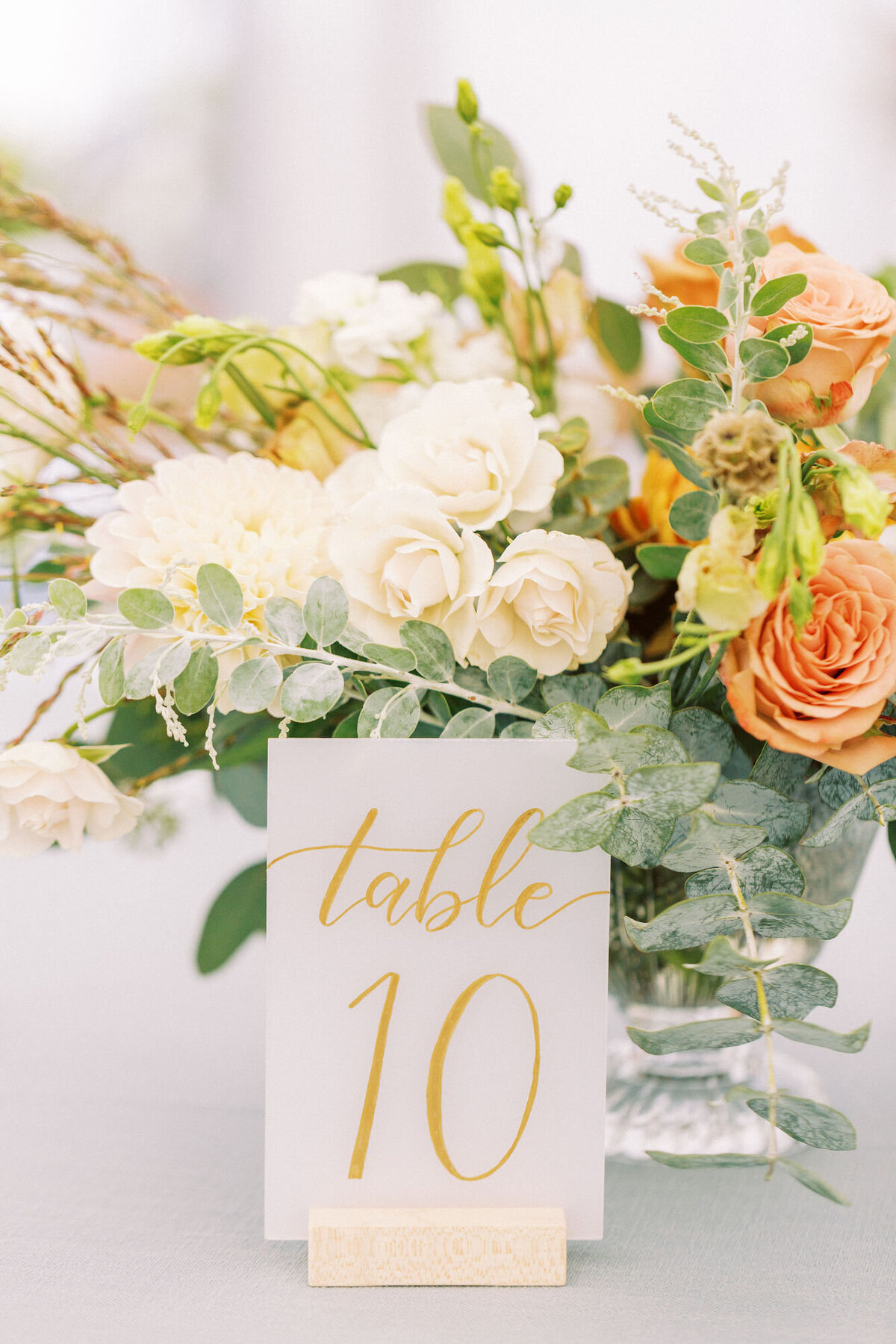 Gold and white frosted acrylic table numbers for a romantic wedding, available for rent in Denver and the Bay Area