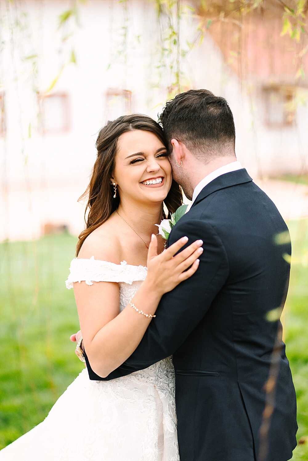 bride and groom laughing together on wedding day captured by wedding photographer-1